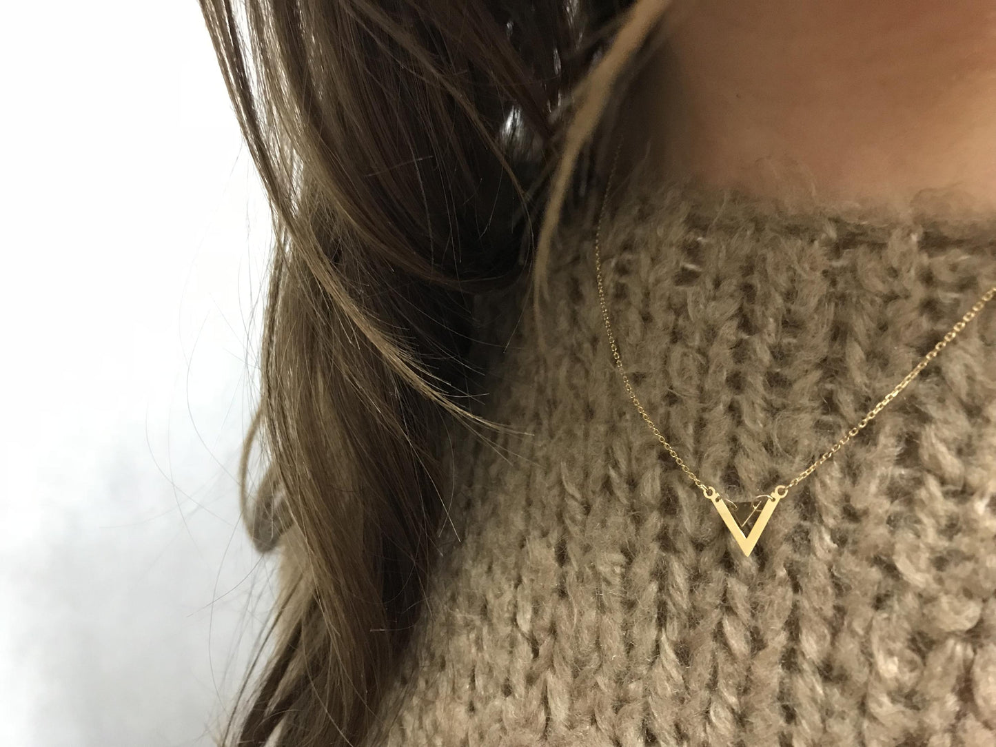 Colgante de oro con triángulo