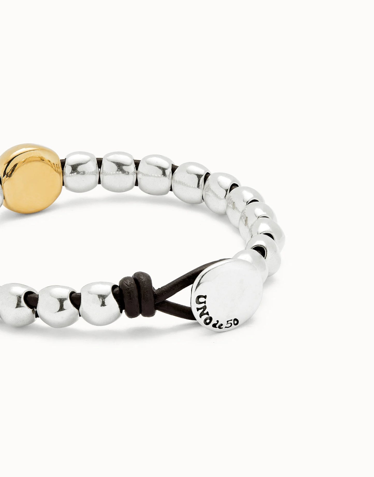 Unode50 Pulsera de bolas y bola central bañada en oro 18k
