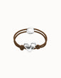 Pulsera de hilo elástico marrón con corazón bañado en plata de ley