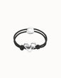 Pulsera de hilo elástico negro con corazón bañado en plata de ley