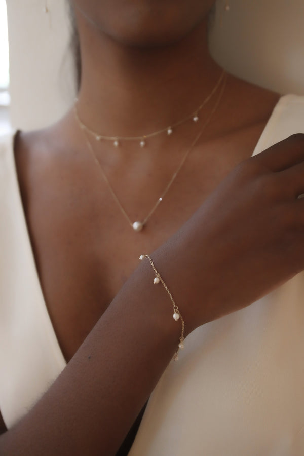 PULSERA IMARA PERLES ORO 9K